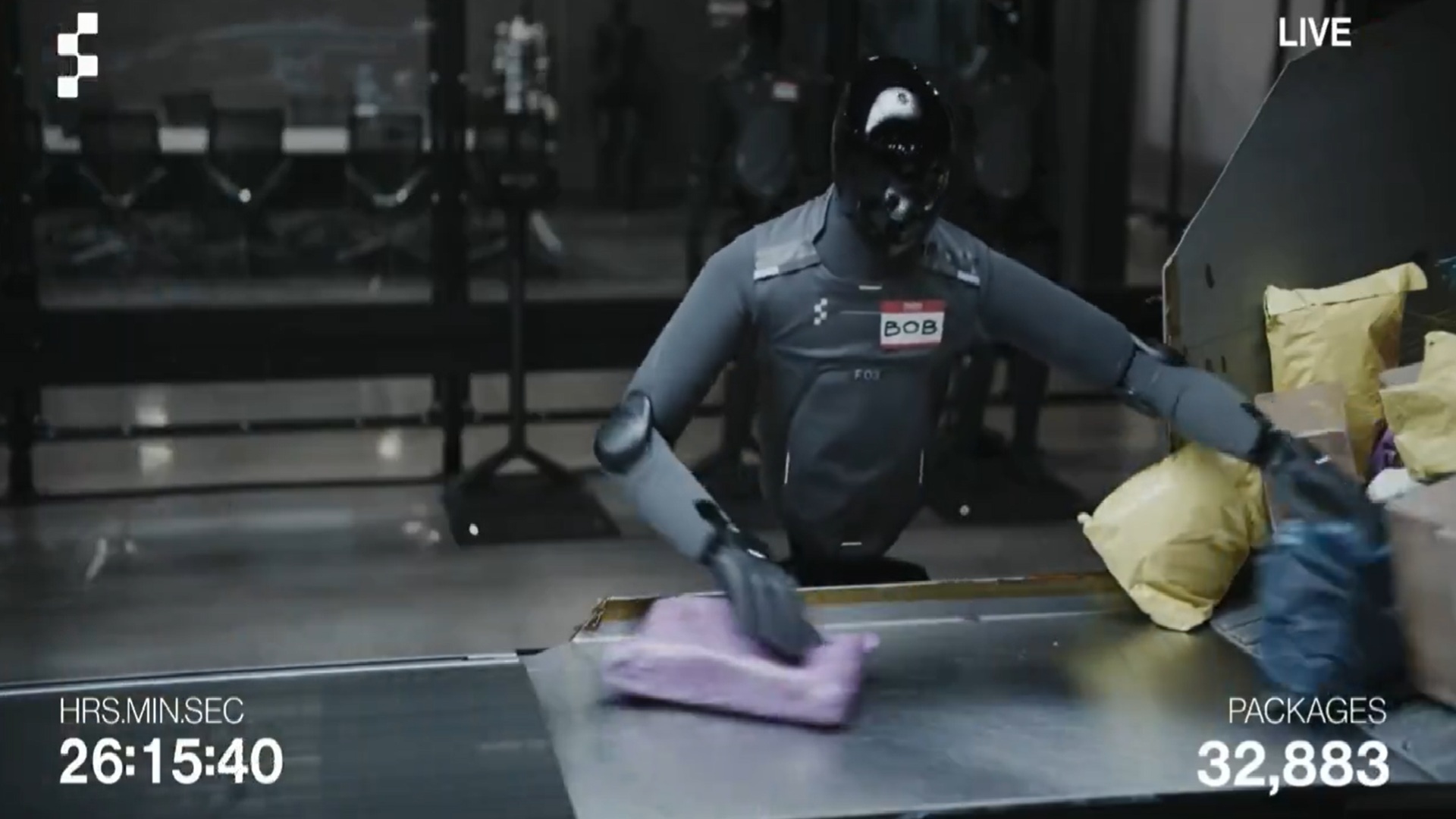 Figure AI humanoid robots sorting packages on a warehouse conveyor